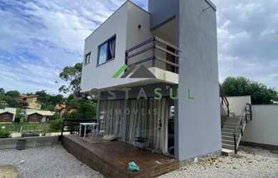 Imagem: A casa possui 3 Dormitórios, 3 Banheiros, 3 Vagas na garagem