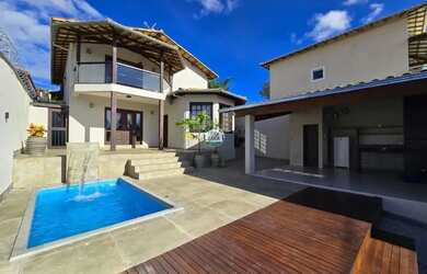 Imagem: A casa possui 3 Dormitórios, 5 Banheiros, 4 Vagas na garagem