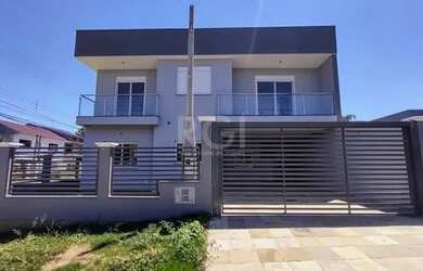 Imagem: A casa possui 3 Dormitórios, 2 Banheiros, 2 Vagas na garagem