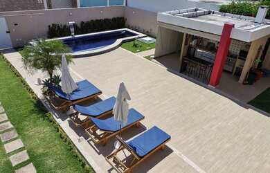 Imagem: A casa possui 4 Dormitórios, 5 Banheiros, 3 Vagas na garagem