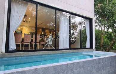 Imagem: A casa possui 3 Dormitórios, 4 Banheiros, 4 Vagas na garagem