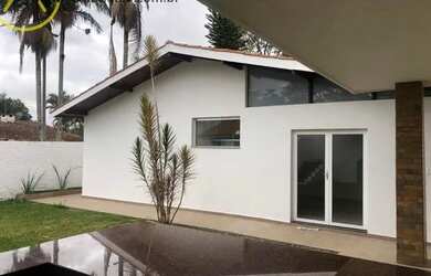 Imagem: A casa possui 3 Dormitórios, 4 Banheiros, 4 Vagas na garagem