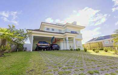Imagem: A casa em condomínio possui 5 Dormitórios, 5 Banheiros, 4