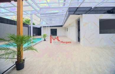 Imagem: A casa possui 5 Dormitórios, 5 Banheiros, 5 Vagas na garagem