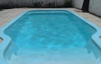 Imagem: A casa possui 3 Dormitórios, 2 Banheiros, 4 Vagas na garagem