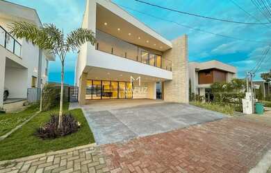 Imagem: A casa possui 4 Dormitórios, 5 Banheiros, 4 Vagas na garagem