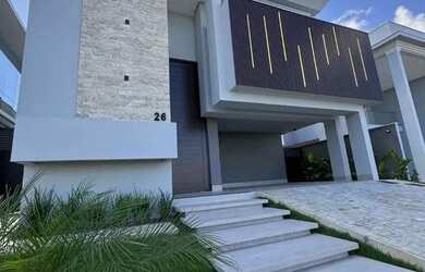 Imagem: A casa possui 4 Dormitórios, 5 Banheiros, 4 Vagas na garagem