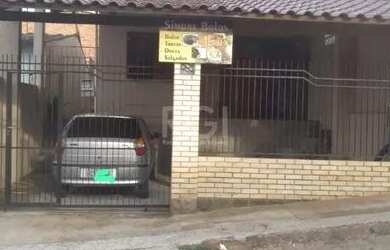 Imagem: A casa possui 3 Dormitórios, 2 Banheiros, 1 Vaga na garagem