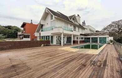 Imagem: A casa em condomínio possui 4 Dormitórios, 5 Banheiros, 4