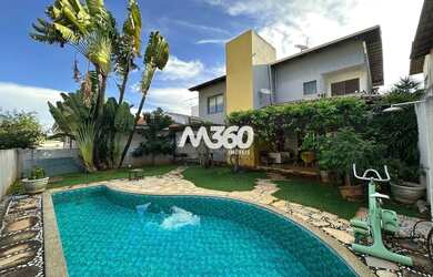 Imagem: A casa possui 4 Dormitórios, 4 Banheiros, 4 Vagas na garagem