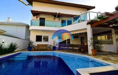 Imagem: A casa em condomínio possui 4 Dormitórios, 5 Banheiros, 2