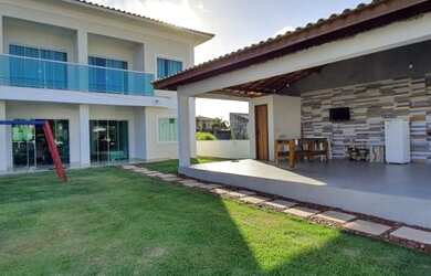 Imagem: A casa possui 5 Dormitórios, 4 Vagas na garagem e está localizado