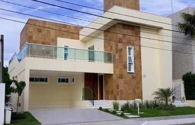 Imagem: A casa possui 4 Dormitórios, 5 Banheiros, 4 Vagas na garagem