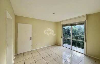 Imagem: O apartamento possui 3 Dormitórios, 1 Banheiro, 1 Vaga na garagem