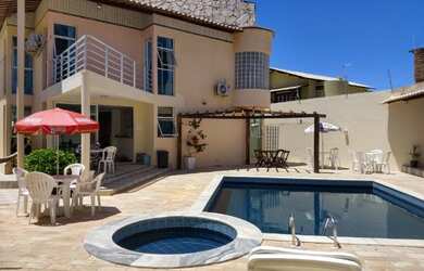 Imagem: A casa possui 5 Dormitórios, 5 Vagas na garagem, Churrasqueira