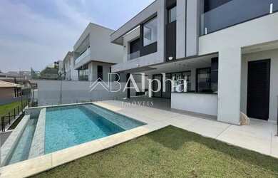 Imagem: A casa em condomínio possui 4 Dormitórios, 4 Banheiros, 5