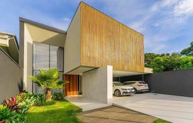 Imagem: A casa possui 3 Dormitórios, 5 Banheiros, 4 Vagas na garagem