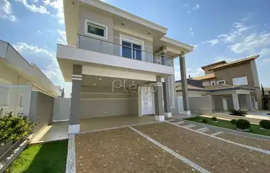 Imagem: A casa possui 4 Dormitórios, 2 Banheiros, 4 Vagas na garagem