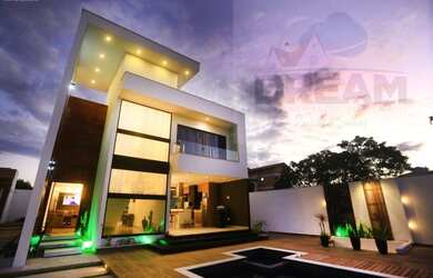 Imagem: A casa e possui 3 Dormitórios, Suítes, 2 Banheiros, 4 Vagas