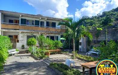 Imagem: A casa possui 2 Dormitórios, 3 Banheiros, 3 Vagas na garagem