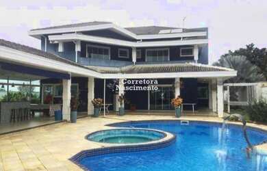 Imagem: A casa possui 5 Dormitórios, 5 Banheiros, 5 Vagas na garagem