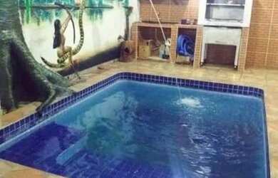 Imagem: A casa possui 2 Dormitórios, 3 Banheiros, 2 Vagas na garagem