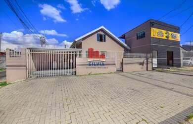 Imagem: A casa possui 2 Dormitórios, 3 Banheiros, 4 Vagas na garagem