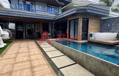 Imagem: A casa em condomínio possui 3 Dormitórios, 4 Banheiros, 3