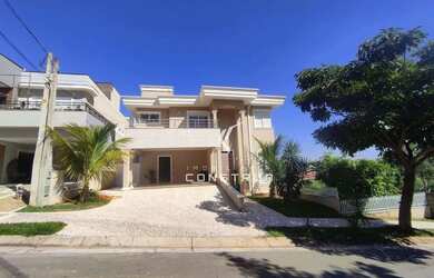 Imagem: A casa em condomínio e possui 4 Dormitórios, Suítes, 5 Banheiros