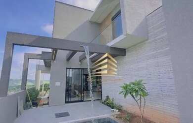 Imagem: A casa possui 3 Dormitórios, 3 Banheiros, 4 Vagas na garagem