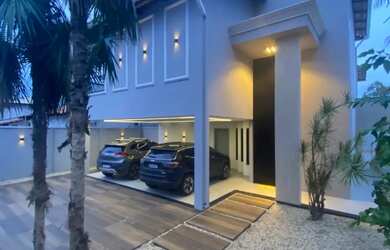 Imagem: A casa possui 3 Dormitórios, 5 Banheiros, 4 Vagas na garagem