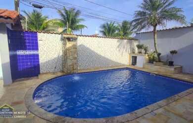 Imagem: A casa possui 4 Dormitórios, 4 Banheiros, 5 Vagas na garagem