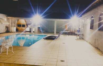 Imagem: A casa possui 5 Dormitórios, 5 Vagas na garagem e está localizado