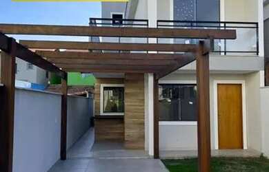 Imagem: A casa possui 3 Dormitórios, 3 Banheiros, 4 Vagas na garagem