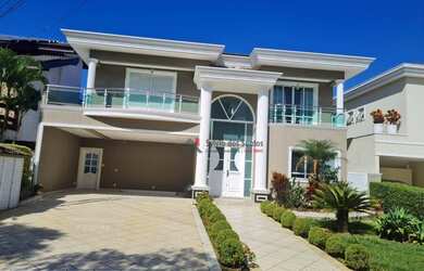 Imagem: A casa em condomínio possui 4 Dormitórios, 5 Banheiros, 4