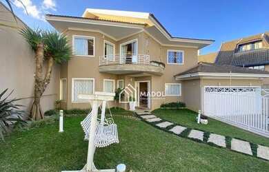 Imagem: A casa possui 3 Dormitórios, 4 Banheiros, 4 Vagas na garagem