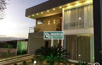 Imagem: A casa possui 4 Dormitórios, 4 Banheiros, 4 Vagas na garagem