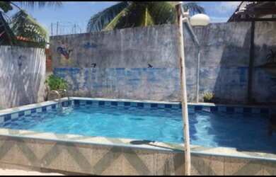 Imagem: A casa possui 2 Dormitórios, 5 Vagas na garagem e está localizado