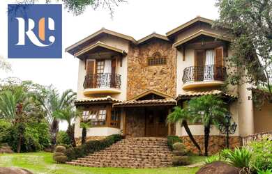 Imagem: A casa possui 5 Dormitórios, 5 Banheiros, 5 Vagas na garagem