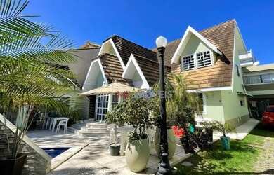 Imagem: A casa possui 5 Dormitórios, 5 Banheiros, 4 Vagas na garagem