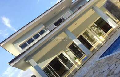 Imagem: A casa em condomínio possui 4 Dormitórios, 5 Banheiros, 4