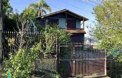 Imagem: A casa possui 3 Dormitórios, 1 Banheiro, 156m² de Área e