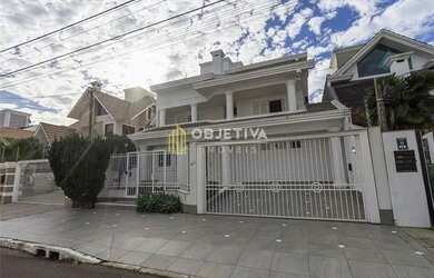 Imagem: A casa possui 4 Dormitórios, 5 Banheiros, 5 Vagas na garagem