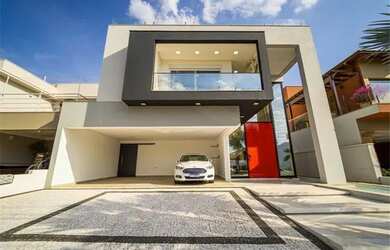 Imagem: A casa possui 3 Dormitórios, 4 Banheiros, 3 Vagas na garagem