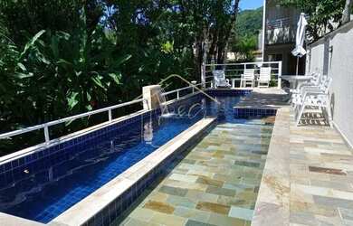 Imagem: A casa em condomínio possui 4 Dormitórios, 5 Banheiros, 2