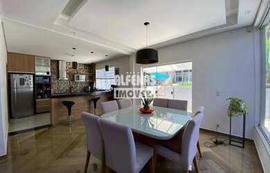 Imagem: A casa possui 3 Dormitórios, 5 Banheiros, 4 Vagas na garagem