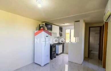 Imagem: O apartamento possui 2 Dormitórios, 1 Banheiro, 1 Vaga na garagem