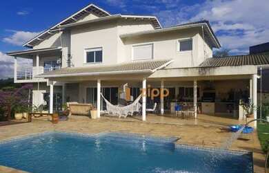 Imagem: A casa em condomínio possui 4 Dormitórios, 5 Banheiros, 5