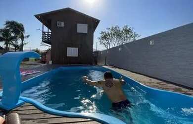 Imagem: A casa possui 4 Dormitórios, 4 Vagas na garagem e está localizado