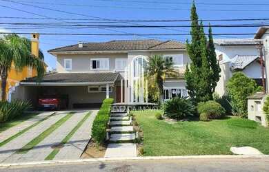 Imagem: A casa possui 5 Dormitórios, 5 Banheiros, 5 Vagas na garagem